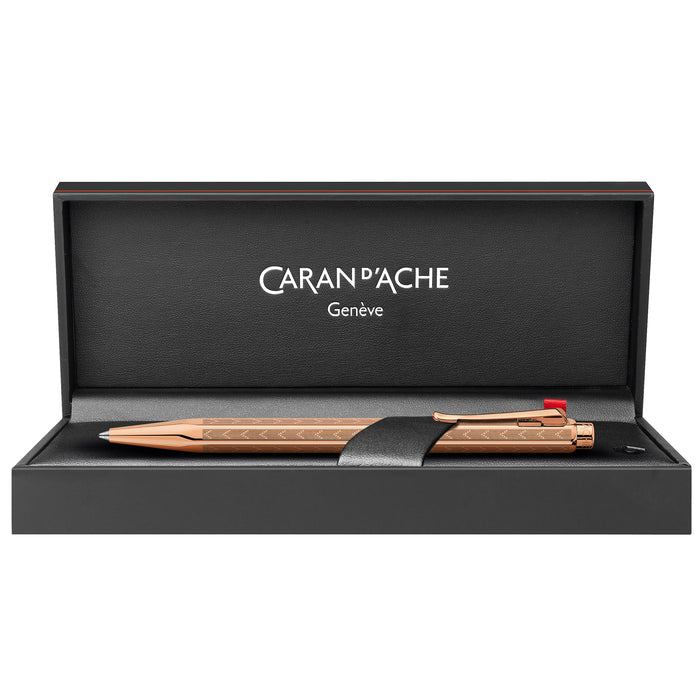 Caran d'Ache 849 Ecridor Gold Ballpoint Pen - Chevron Rose | Atlas Stationers.