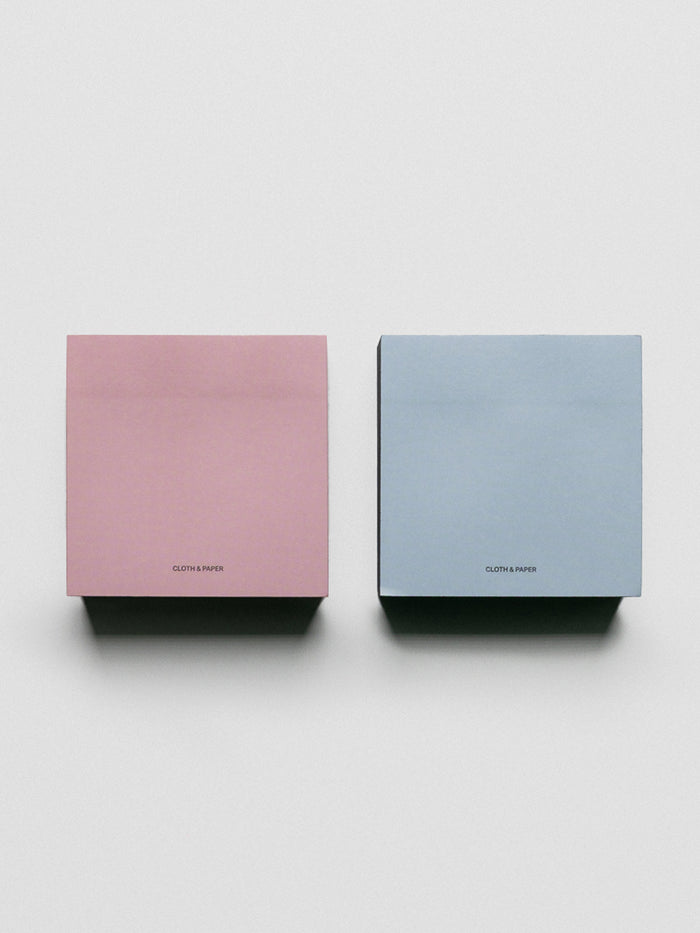 Colorblock Sticky Note Set in pink/red and blue/navy shown side by side.