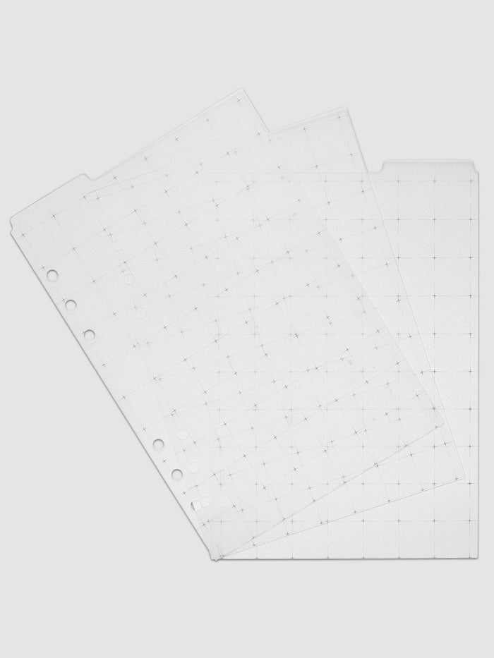 Grid Top Tab Dividers | Ultra-Thin, A5 6-Ring Punch, the set of three fanned at an angle so each tab position shows, black grid print visible through the translucent white plastic onto the sheets below