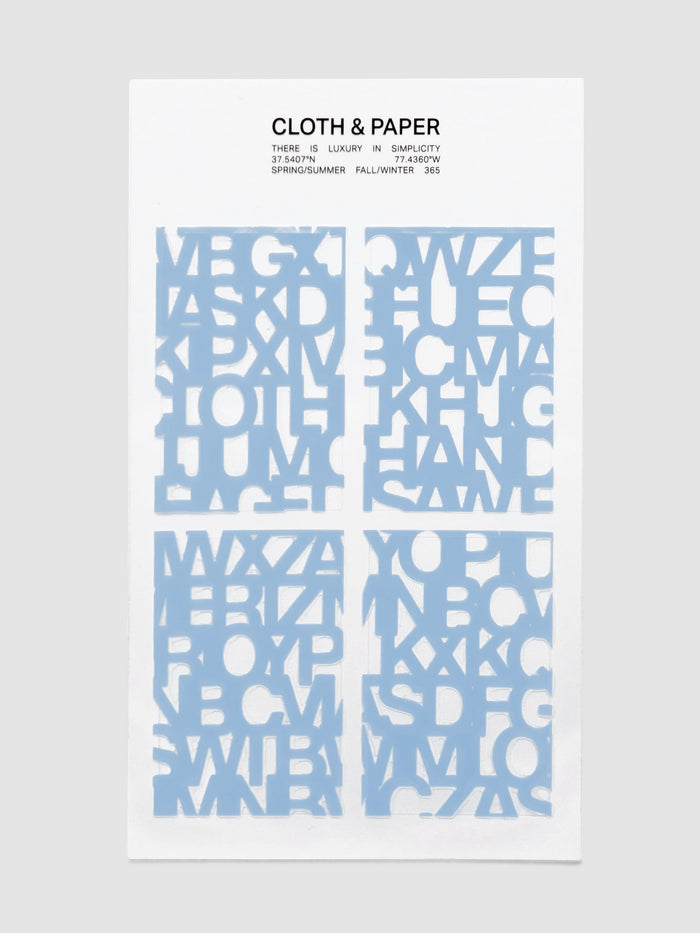 A single sheet of Label Stickers | Precision in Hyacinth, four sticker panels of the blue Precision letter pattern on a printed Cloth and Paper backer card