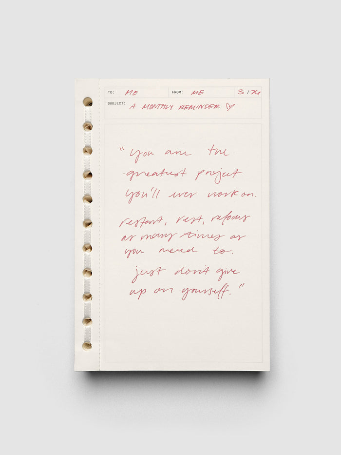 Message pad shown with red handwritten notes.