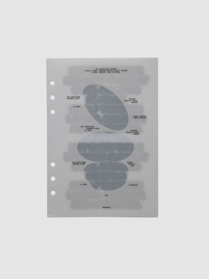 Nuanced Dashboard Trio, A5 6-Ring Punch, single translucent grey dashboard lying flat, printed with stacked slate blue-grey ovals and small black typewriter text
