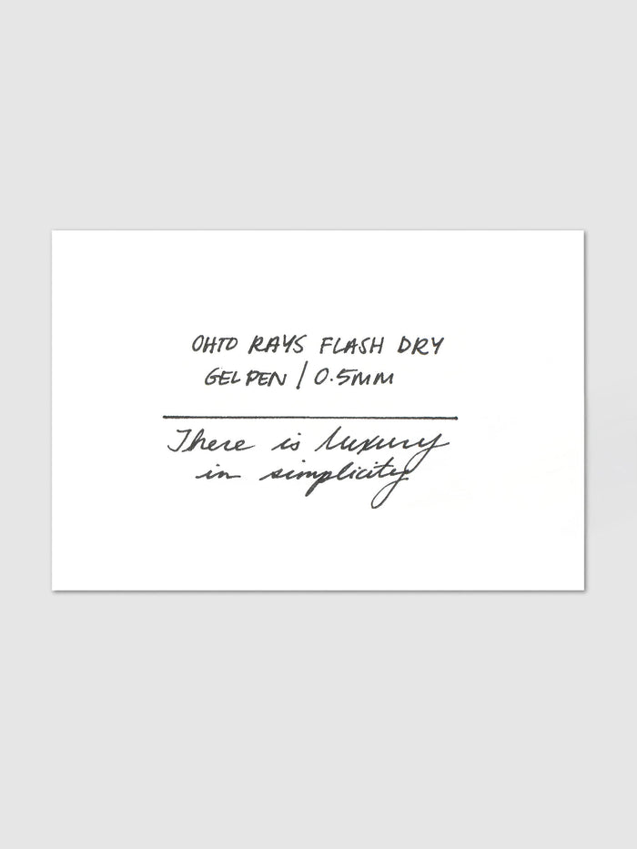 A handwritten writing sample from the OHTO Rays Flash Dry Gel Pen | 0.5 mm in black ink on a white card