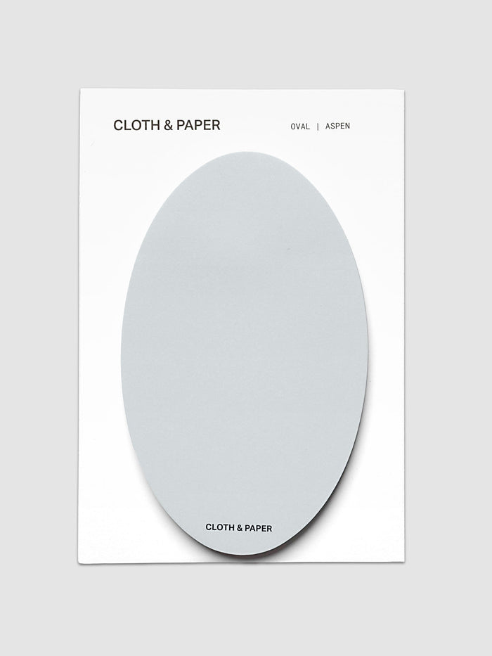 Oval Sticky Notes | Aspen shown from above, one pale blue gray oval pad mounted on a white backing card printed in black with the brand name and colorway