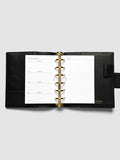 The Pocket Personal Curriculum Planner Inserts open in a black leather ring bound planner to the index spread, four skill entries with purpose and due date on the left and a lined notes page on the right