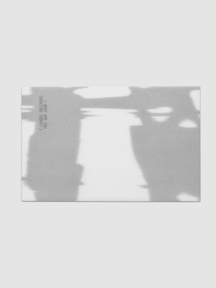 Projection Journaling Card Set, single card printed edge to edge with a blurred gray and white image and one short line of gray type set sideways along the left side