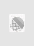 Both designs of the Transparent Semicircle Sticky Notes on their backer card, one solid Ash half circle and one in the Punched Holes pattern meeting to form a full circle